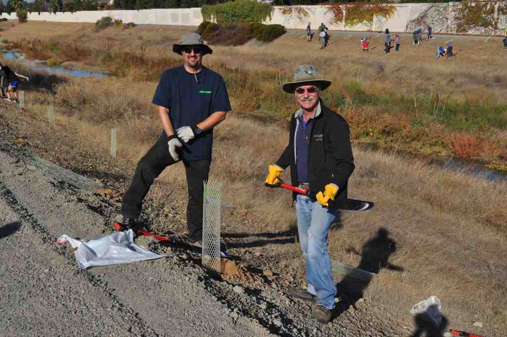 Two people planting